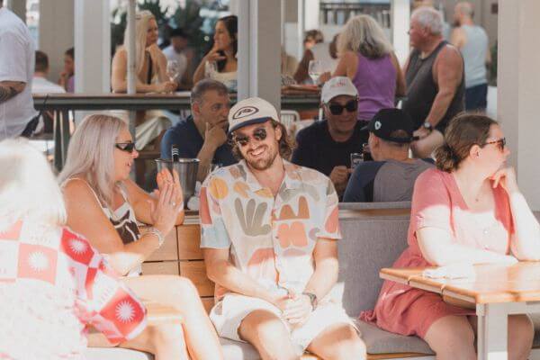crowd enjoying themselves outside in the sun 